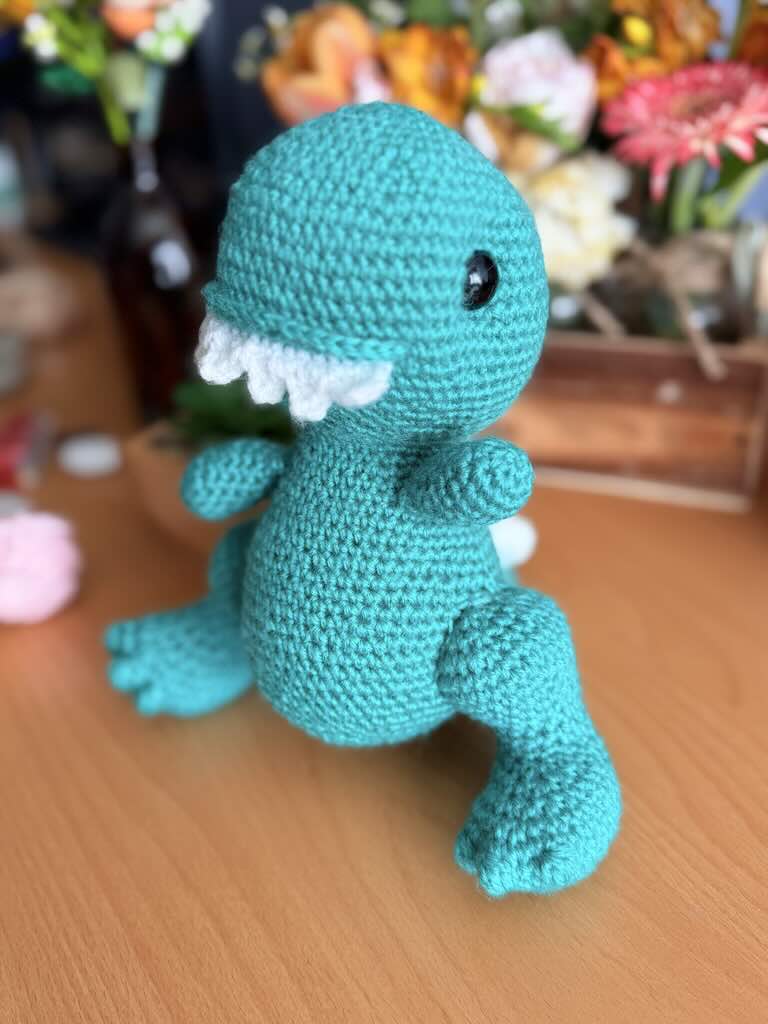 handmade crochet Tyrannosaurus Rex (T-Rex) toy named Ty with tiny arms and big smile