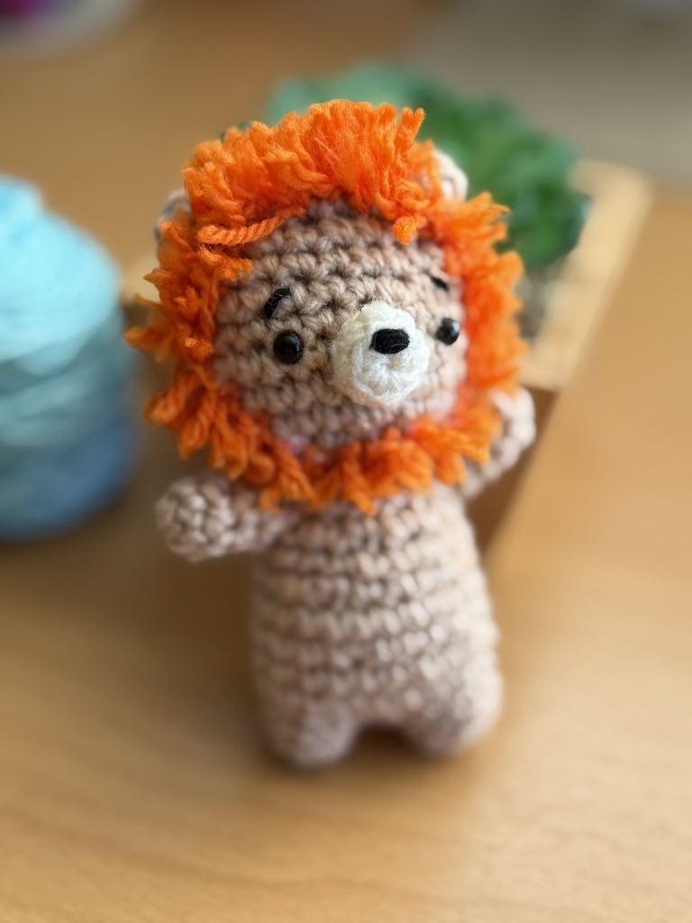 handmade crochet lion toy named Lenny with soft mane and friendly face