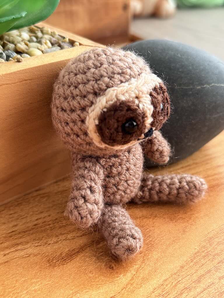 handmade crochet sloth toy named Spud with cozy yarn and lazy charm